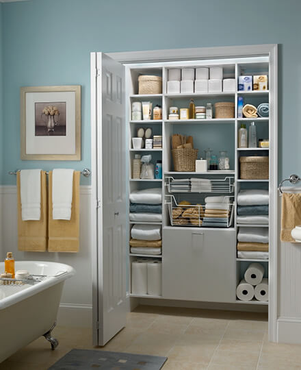 Wood Shelving in a Bathroom Linen Closet